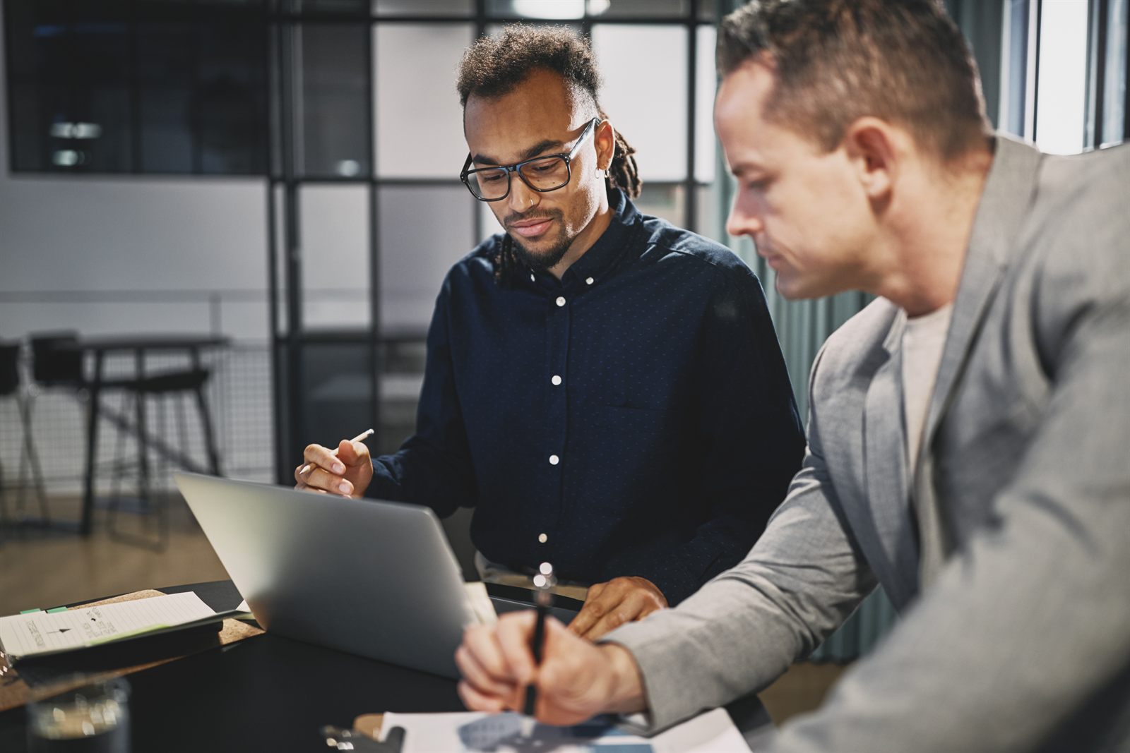 A CPA and a business owner reviewing entity structuring documents